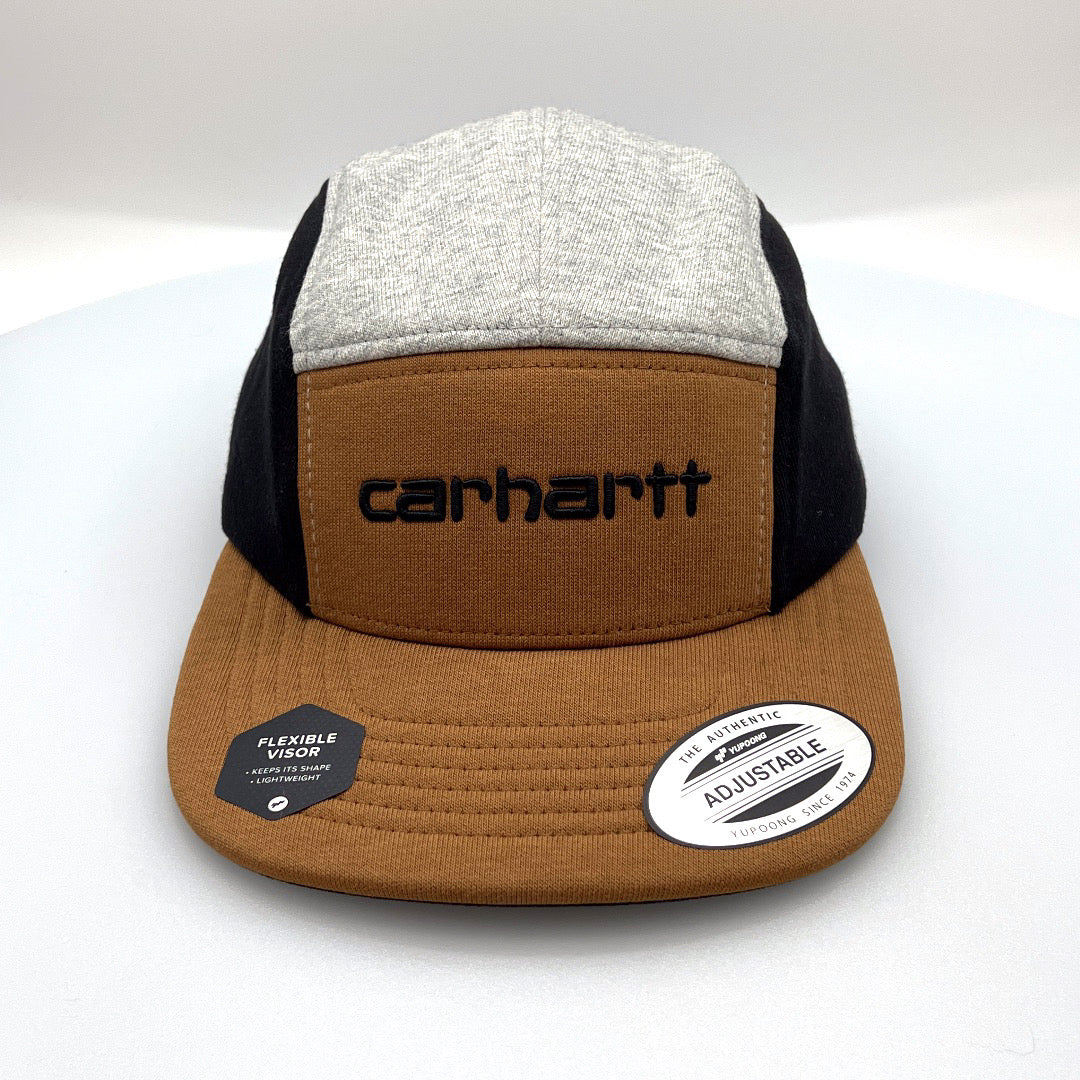 Grey, black and brown Carhartt 5 panel hat with embroider logo on the front, white background.