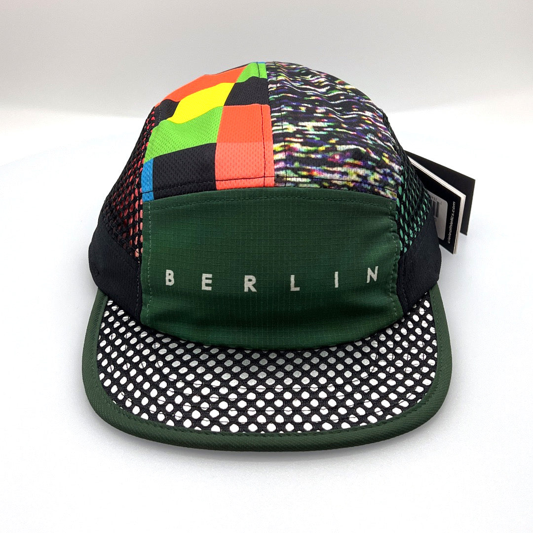 Mix colored Ciele Berlin 5 Panel Hat with netting on side panels, white background.