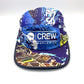 Unique navy, brown and baby blue pattern Paper Planes 5 Panel Hat, CREW Worldwide logo on the front, and a white background.