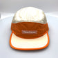 Nylon orange and off white Paper Planes 5 Panel Hat, clear logo on the front, with a white background.