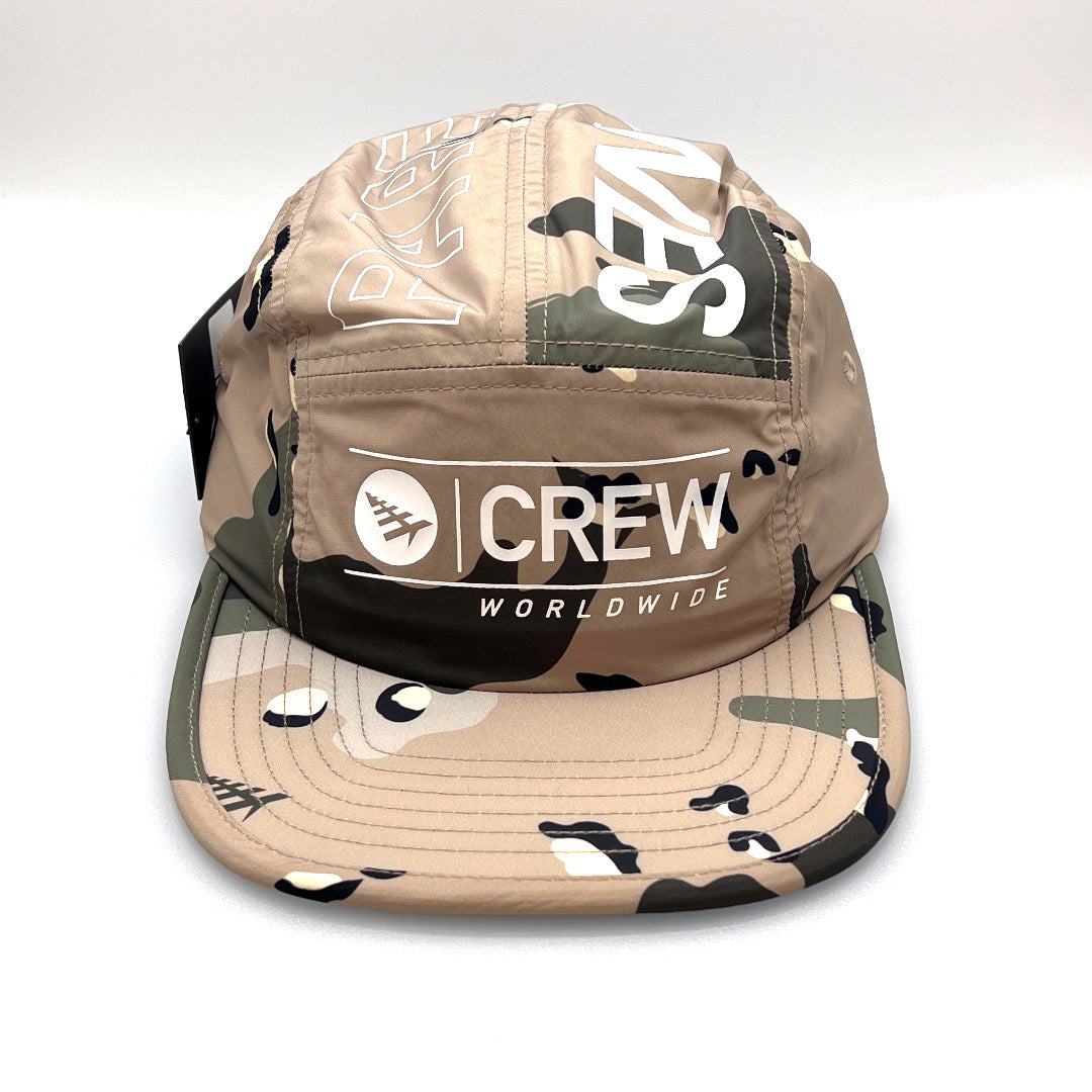 Light brown camo 5 Panel Hat, CREW Worldwide logo on the front, with a white background.
