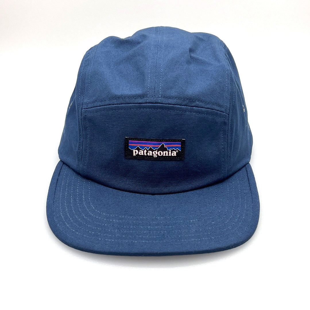 Navy Patagonia 5 Panel Hat, iconic logo on the front, with a white background.