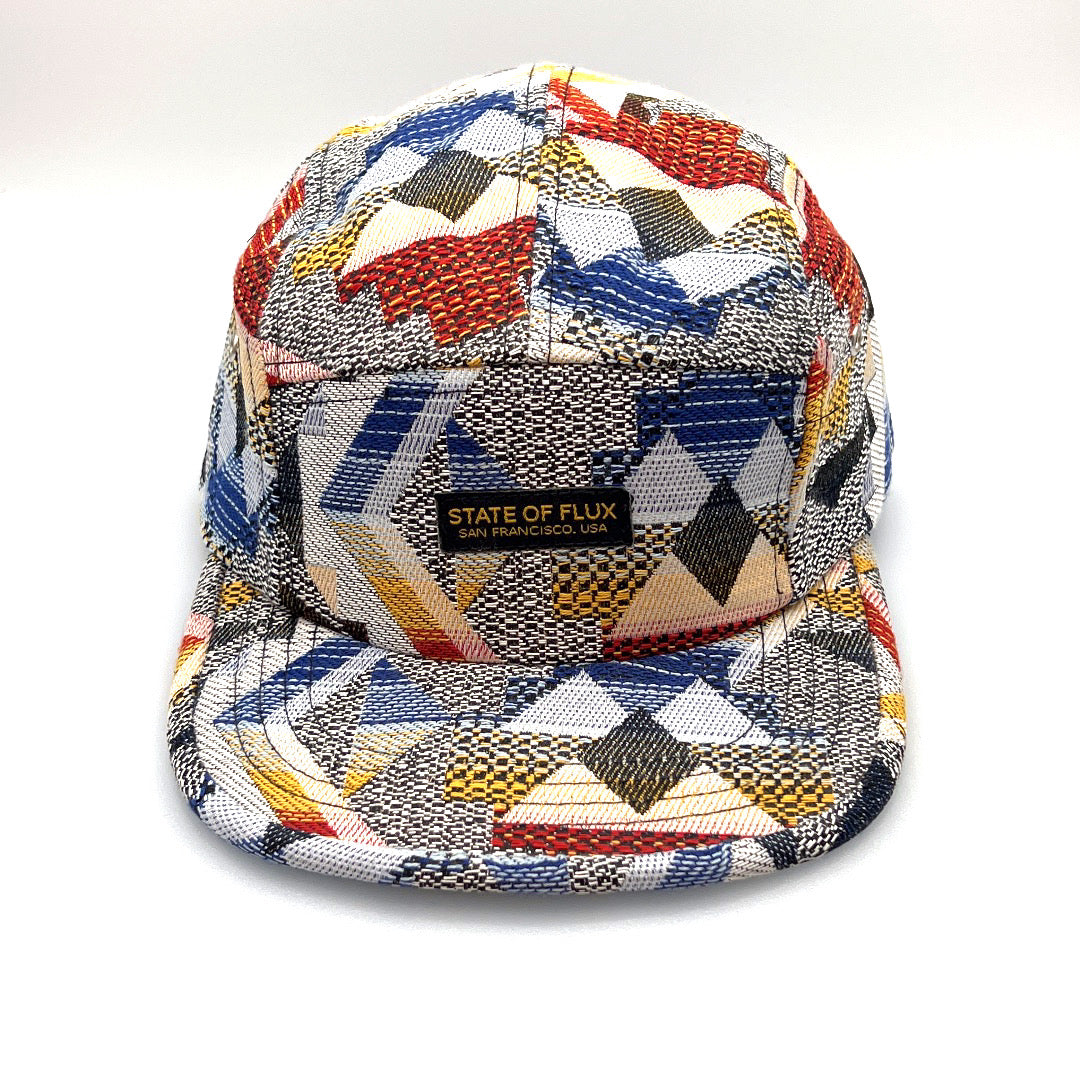 Multicolored State Of Flux 5 Panel Hat, logo label on the front, with a white background.