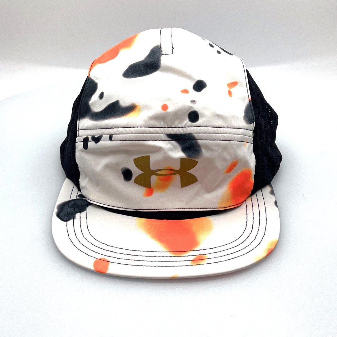 Orange, white, black Under Armour 5 Panel Hat, gold logo on the front, with a white background.