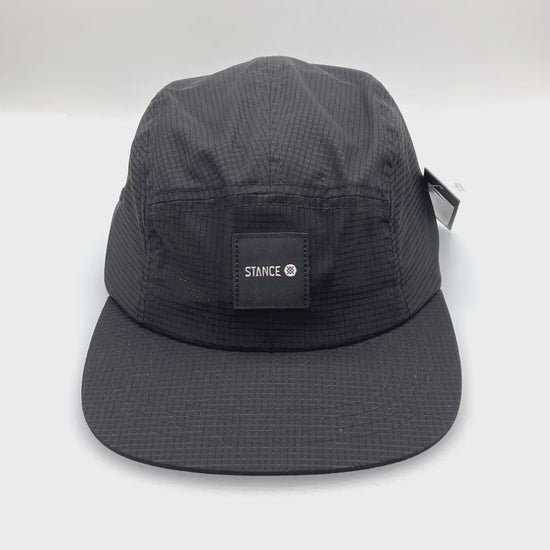 Spinning black nylon Stance Kinectic 5 Panel Hat, with a white background.