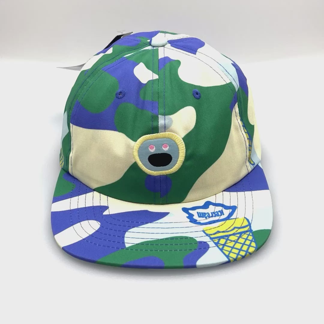 Spinning blue camo IceCream 6-Panel Hat with embroidered logo on the front, white background.