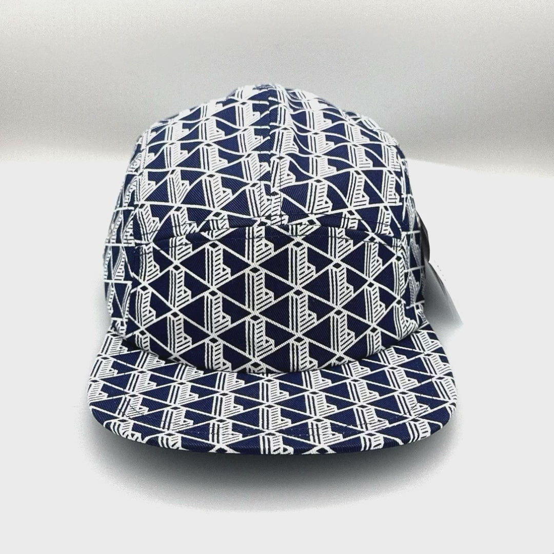 Spinning blue and white Monogram Lacoste 5 Panel Hat, with white background.