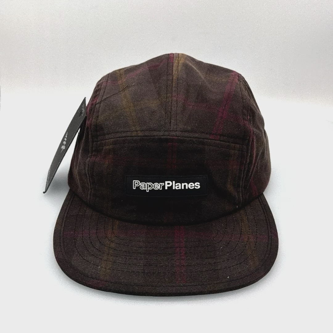 Spinning brown plaid pattern Paper Planes 5 Panel Hat, with a white background.