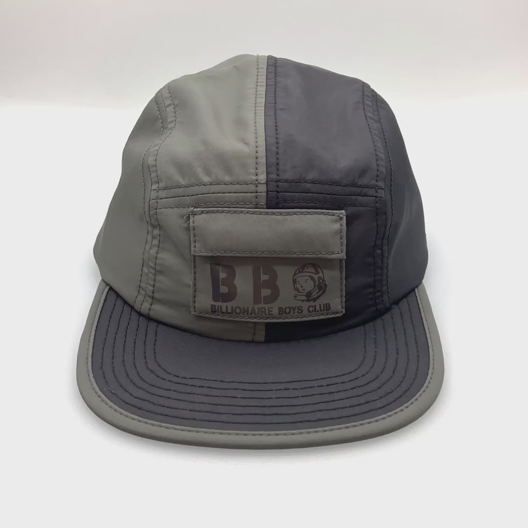 Spinning Bicolor Billionaire Boys Club 5 Panel Hat. Grey and black with a front Panel pocket and black brim.
