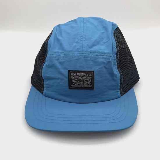Spinning Light Blue Levi Strauss 5 Panel Hat, black mesh on side panels, with white background.