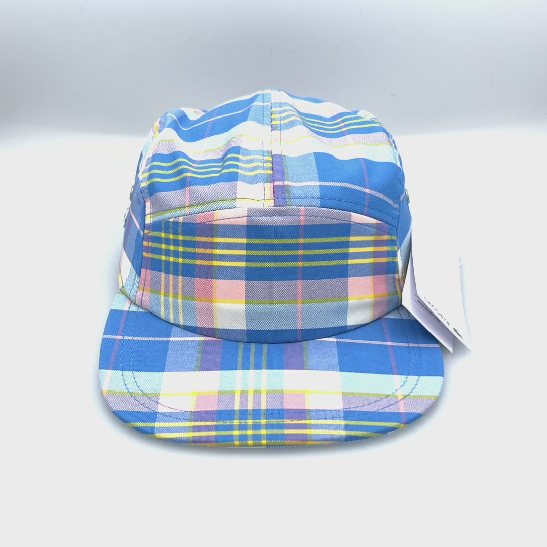 Spinning blue, pink, yellow and white plaid pattern Lacoste 5 Panel Hat, with white background.