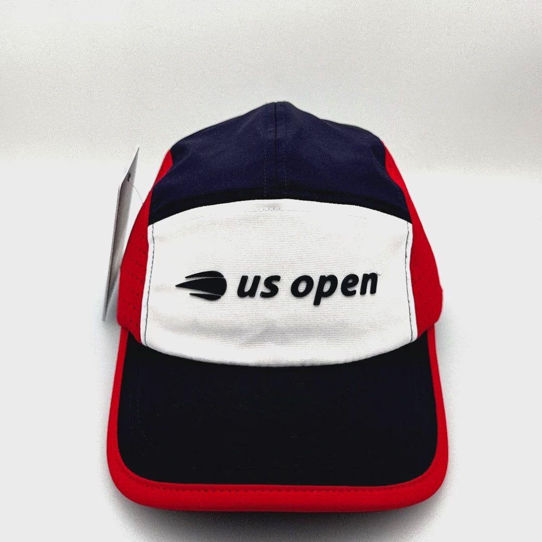 Spinning 2023 red, white and navy US Open 5 Panel Hat, rubber logo on the front, with a white background.