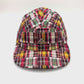 Spinning multi colored plaid LRG 5 Panel Hat, silver metal LRG logo on the front panel, with white background.