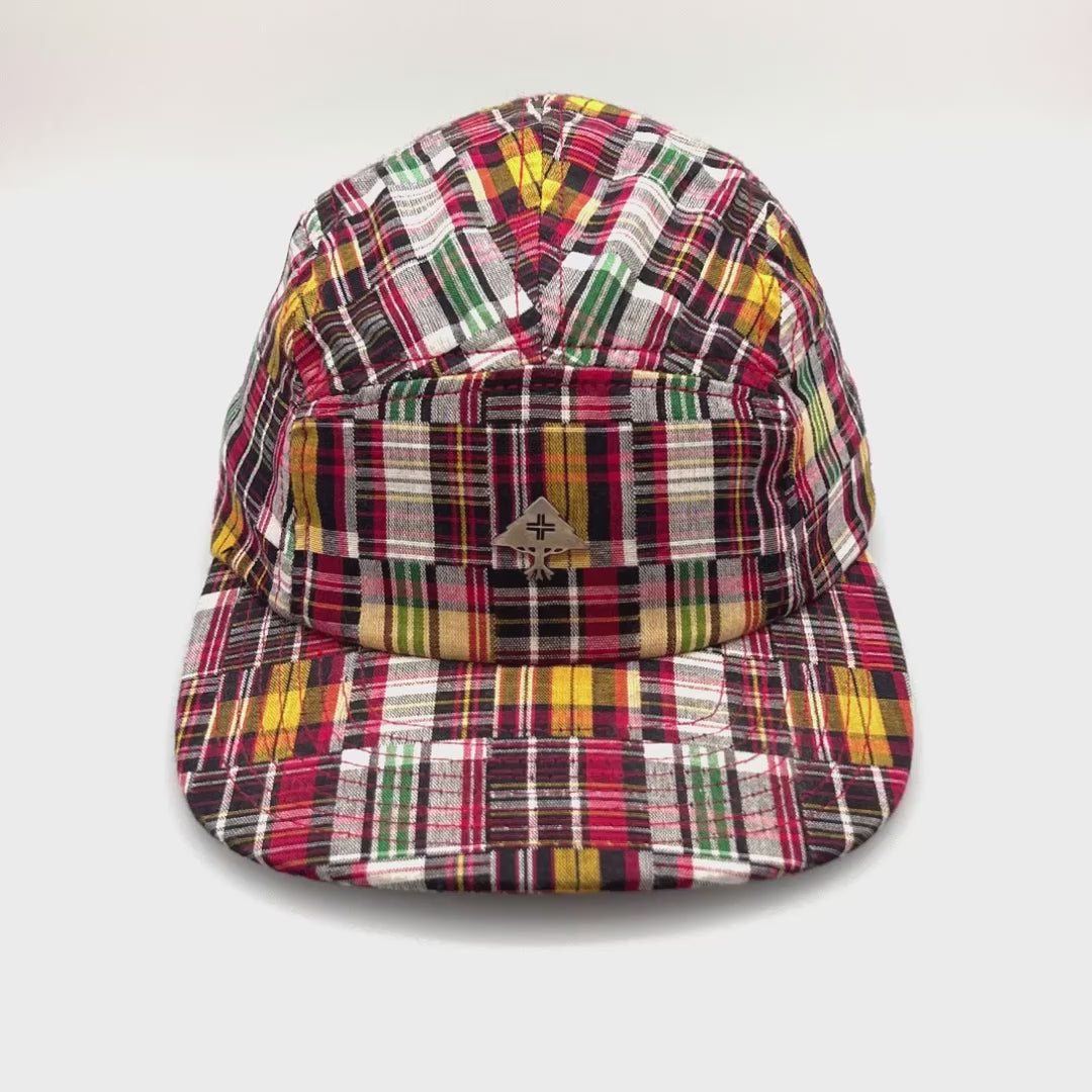 Spinning multi colored plaid LRG 5 Panel Hat, silver metal LRG logo on the front panel, with white background.